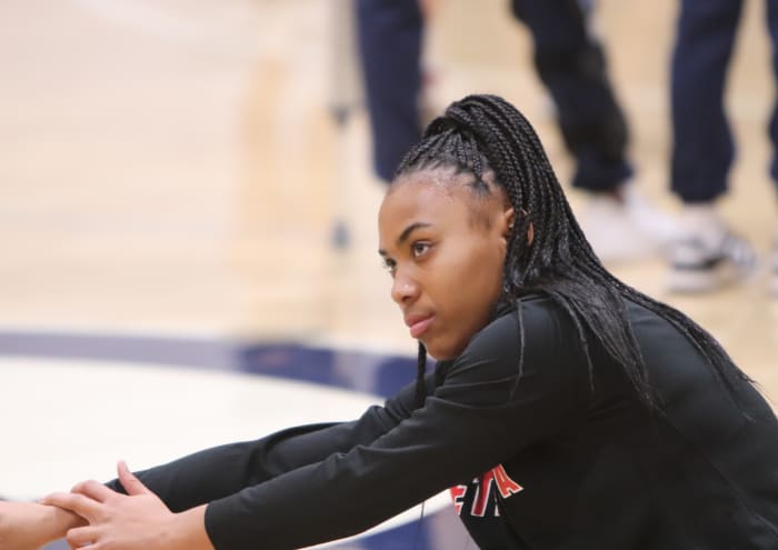 Aliyahna "Puff" Morris stretches before Friday night's game. Photo John Murphy